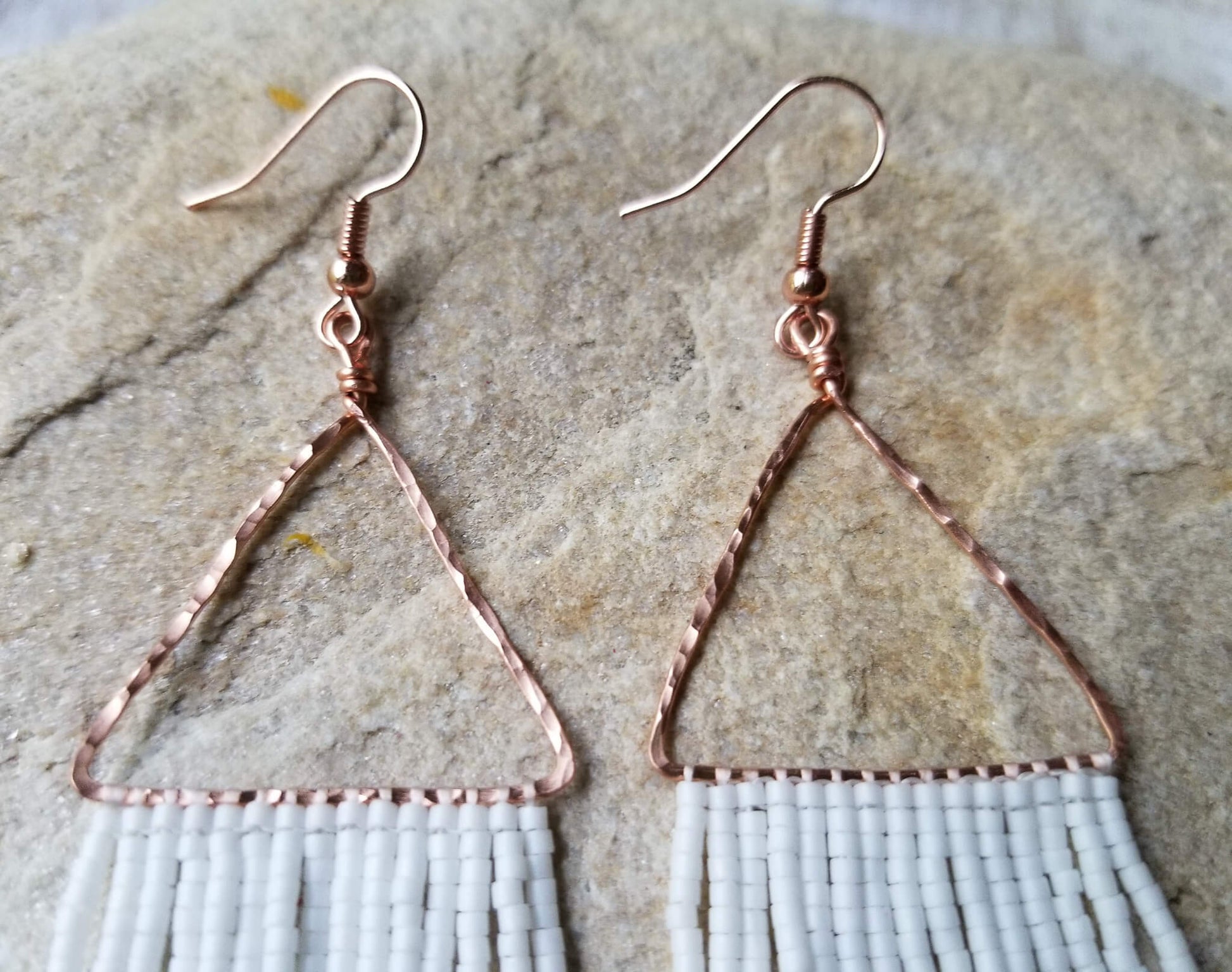 hand hammered copper triangle earring close up